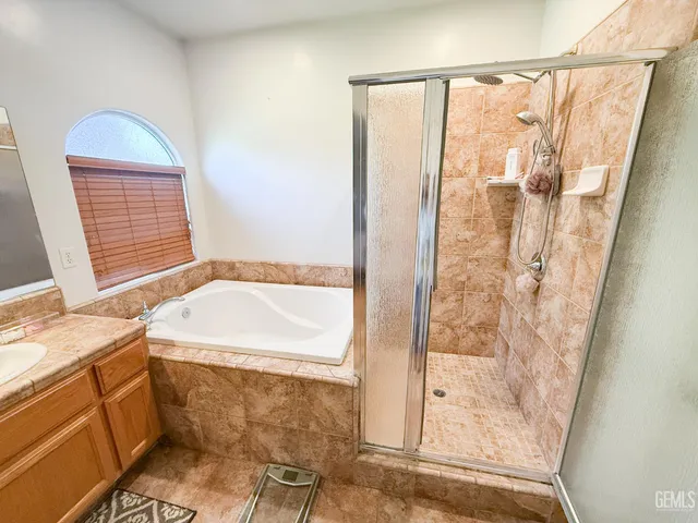 a bathroom with a double vanity sink and mirror