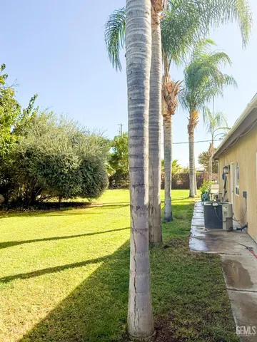 a view of a swimming pool with an outdoor space and seating area