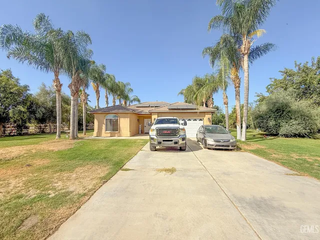 a view of a house with outdoor space and swimming pool