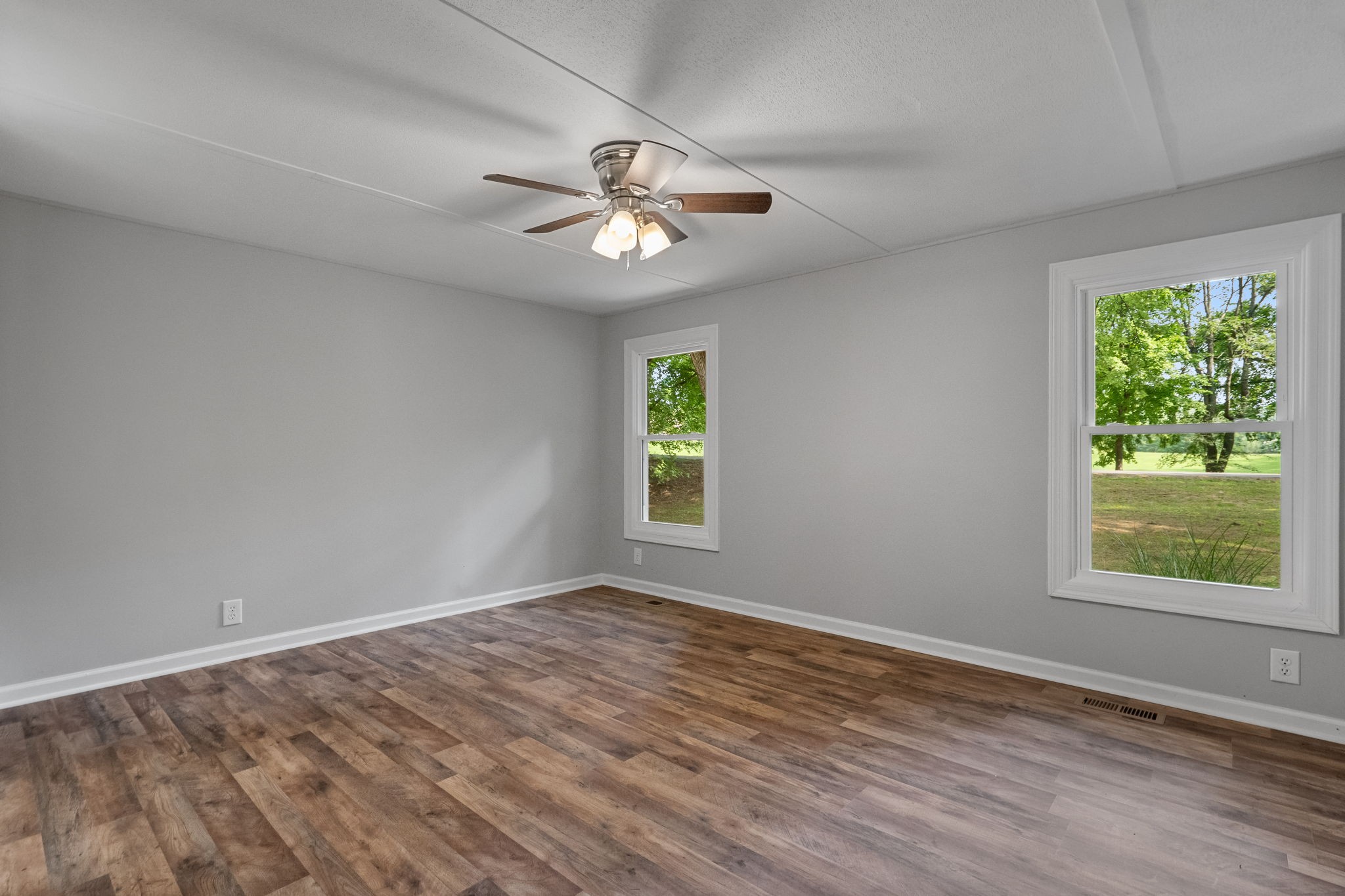 4147 Fizer Road Springfield, TN 37172 - Photo 12 of 25 wooden floor in an empty room with a window