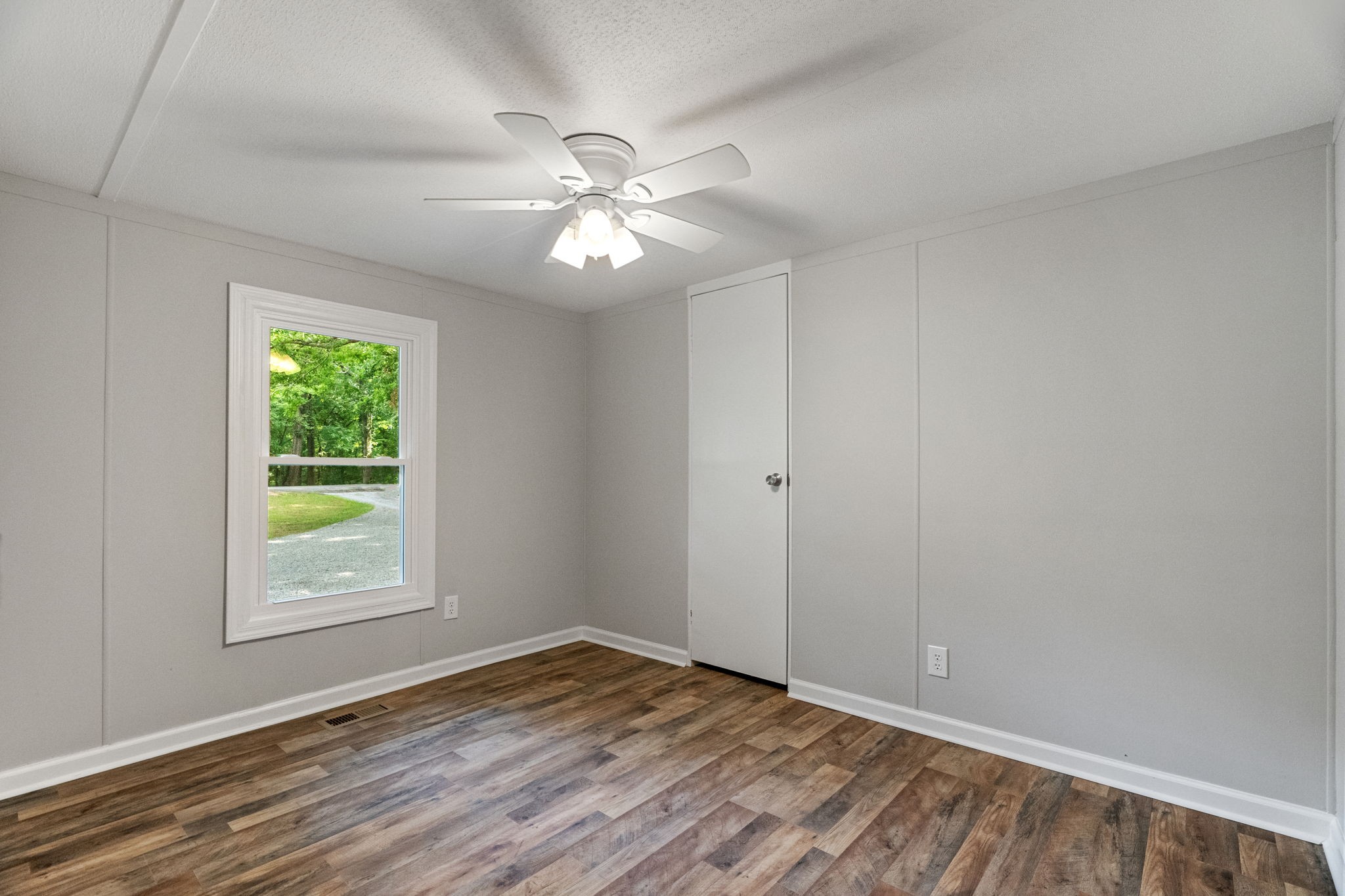 4147 Fizer Road Springfield, TN 37172 - Photo 16 of 25 a view of an empty room with wooden floor and a window