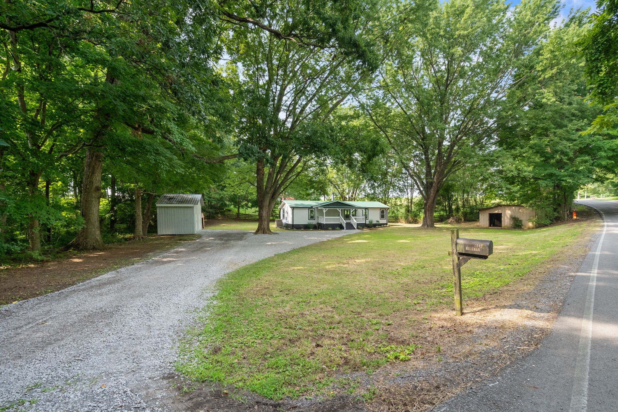 4147 Fizer Road Springfield, TN 37172 - Photo 5 of 25 a house with trees in front of it
