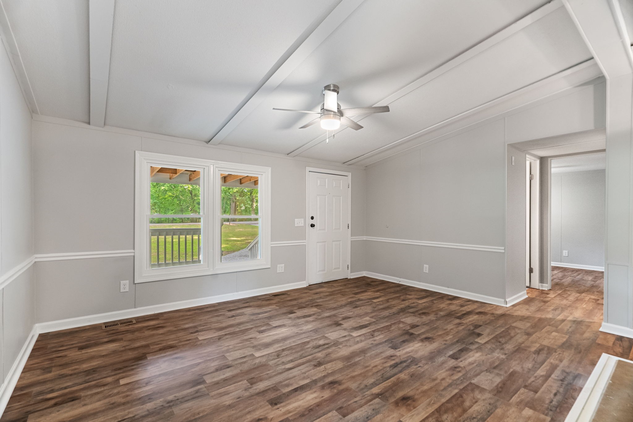 4147 Fizer Road Springfield, TN 37172 - Photo 7 of 25 a view of an empty room with a window and wooden floor