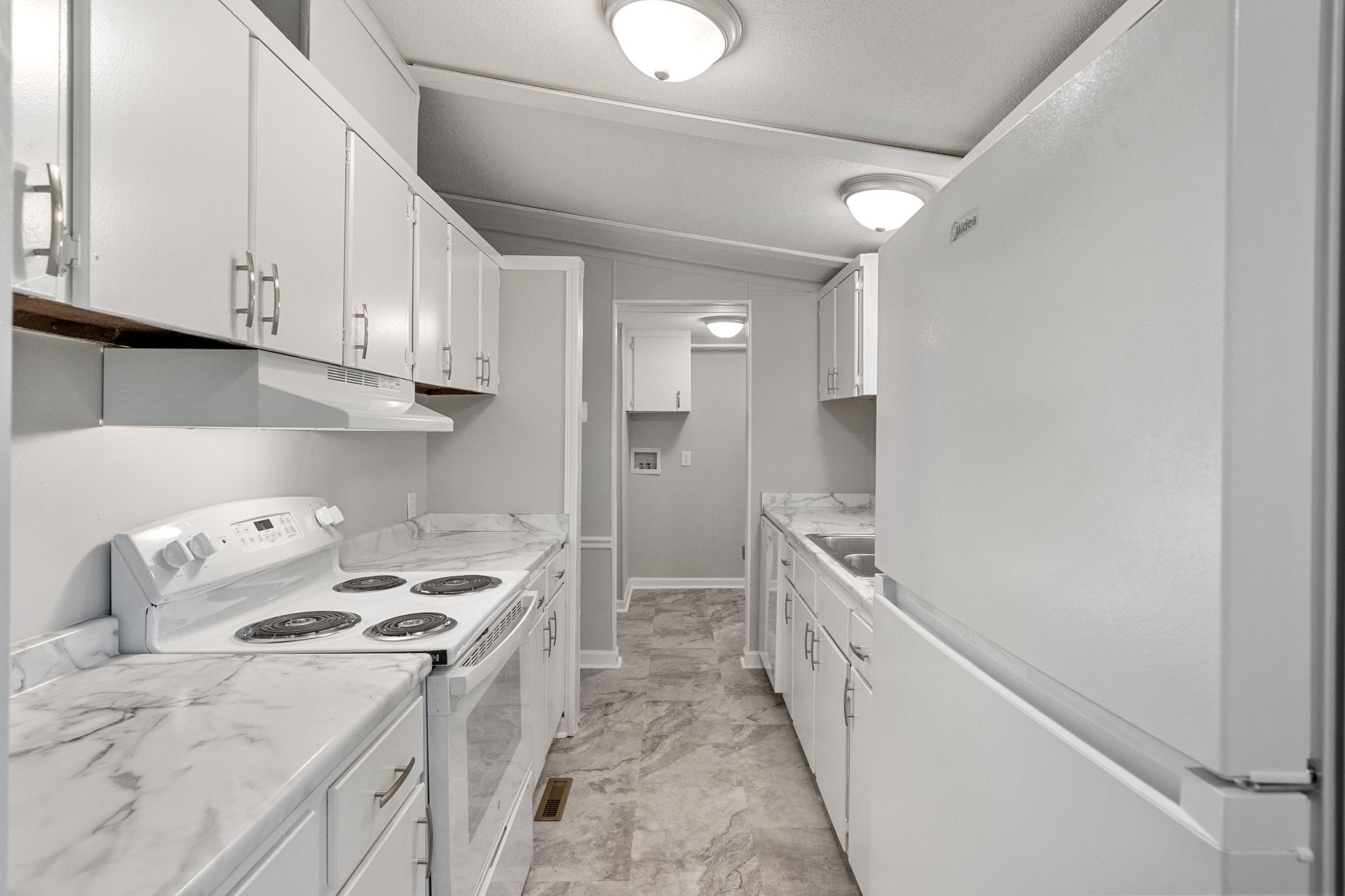 4147 Fizer Road Springfield, TN 37172 - Photo 8 of 25 a kitchen with granite countertop a sink and a stove