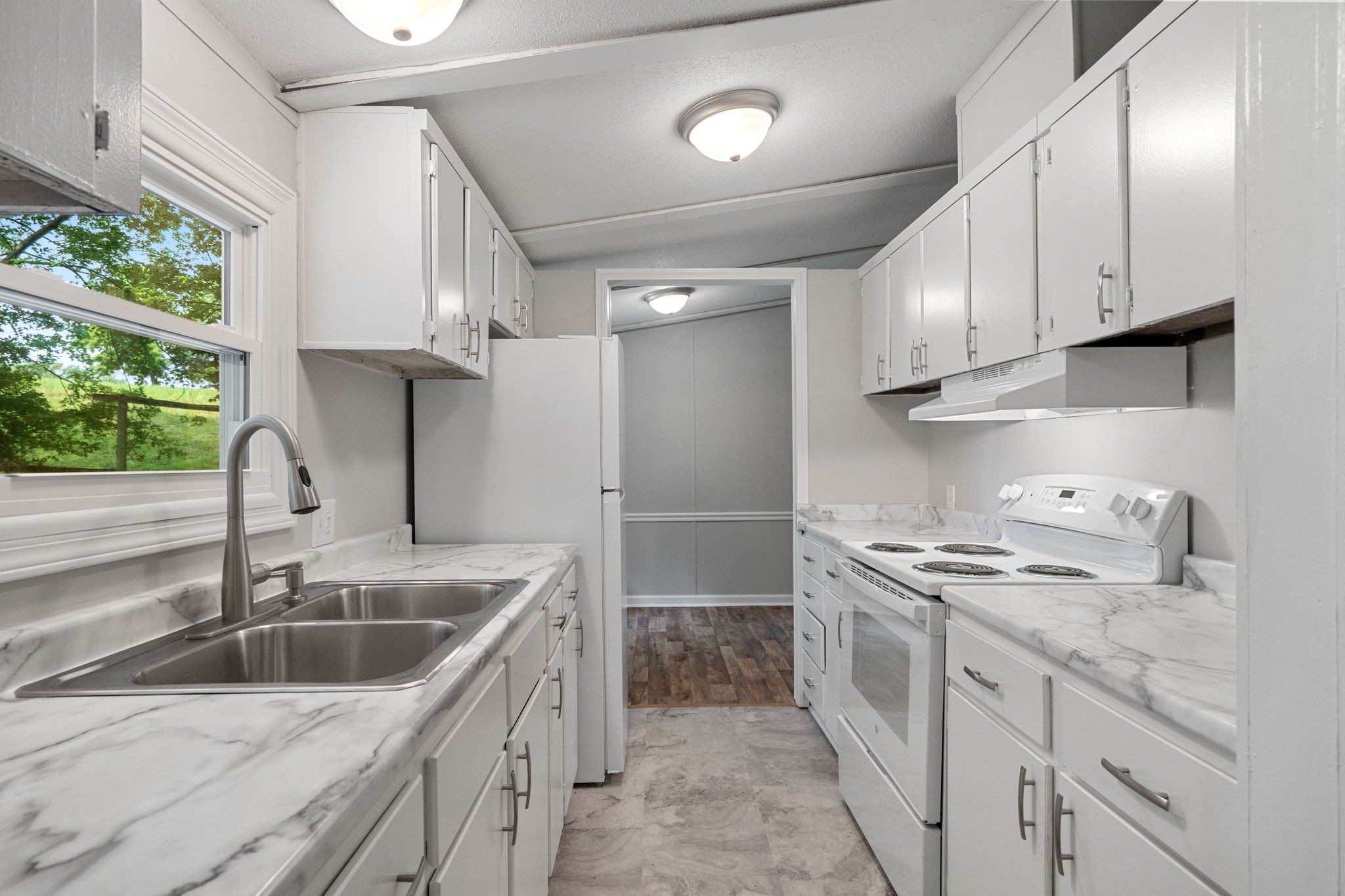 4147 Fizer Road Springfield, TN 37172 - Photo 10 of 25 a kitchen that has a sink a stove and window