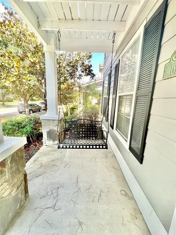 a view of an entryway with a floor to ceiling window and outdoor view