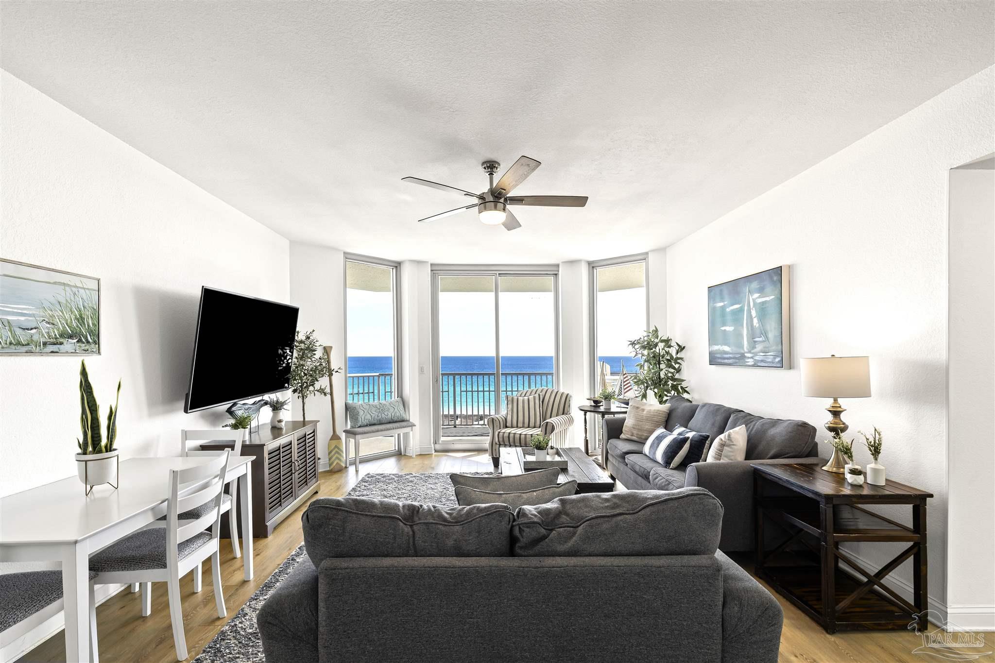 850 Fort Pickens Road, Unit 1040 Pensacola Beach, FL 32561 - Photo 12 of 37 a living room with furniture and a flat screen tv