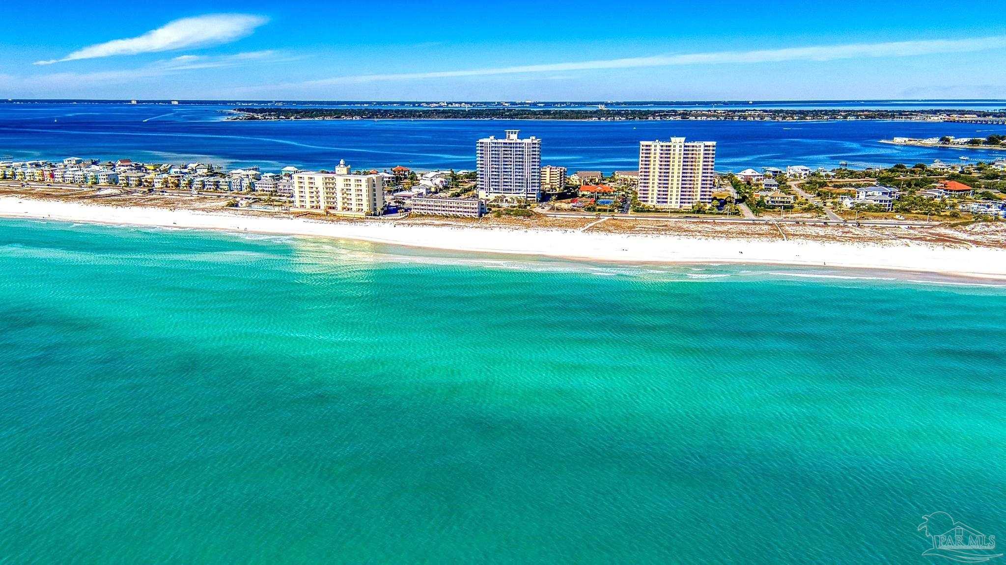 850 Fort Pickens Road, Unit 1040 Pensacola Beach, FL 32561 - Photo 35 of 37 a view of a building with floor to ceiling windows and outdoor view