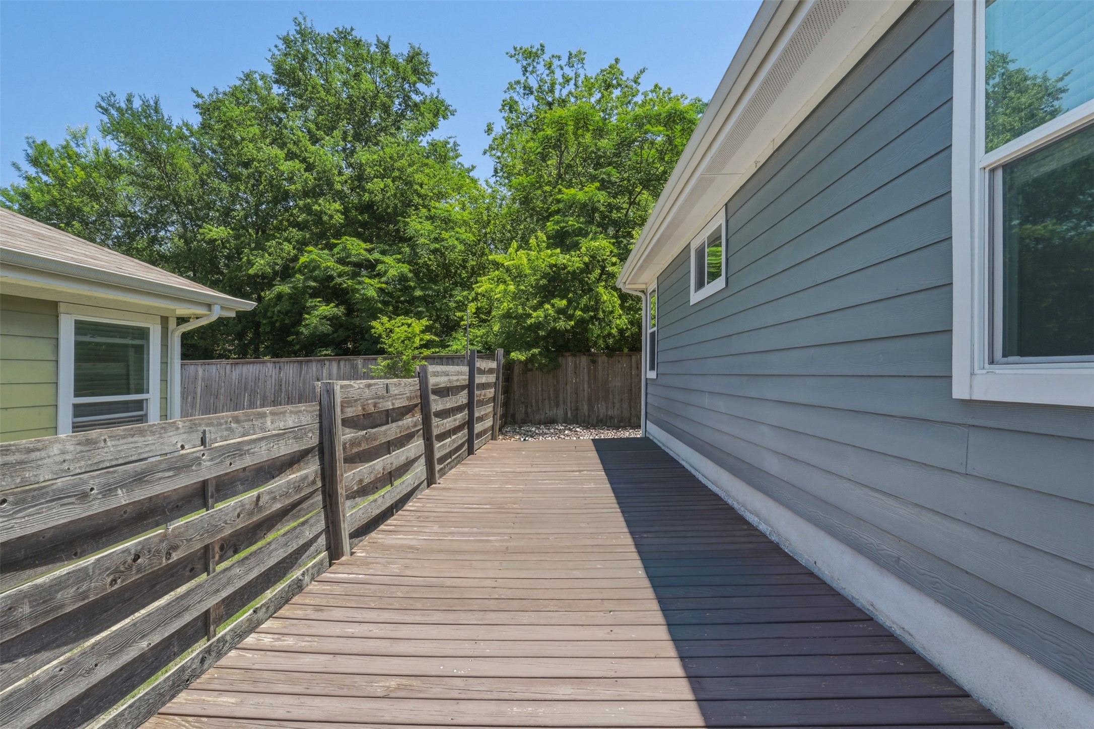7208 Lysander Court Austin, TX 78741 - Photo 15 of 15 a view of a wooden deck besides a house
