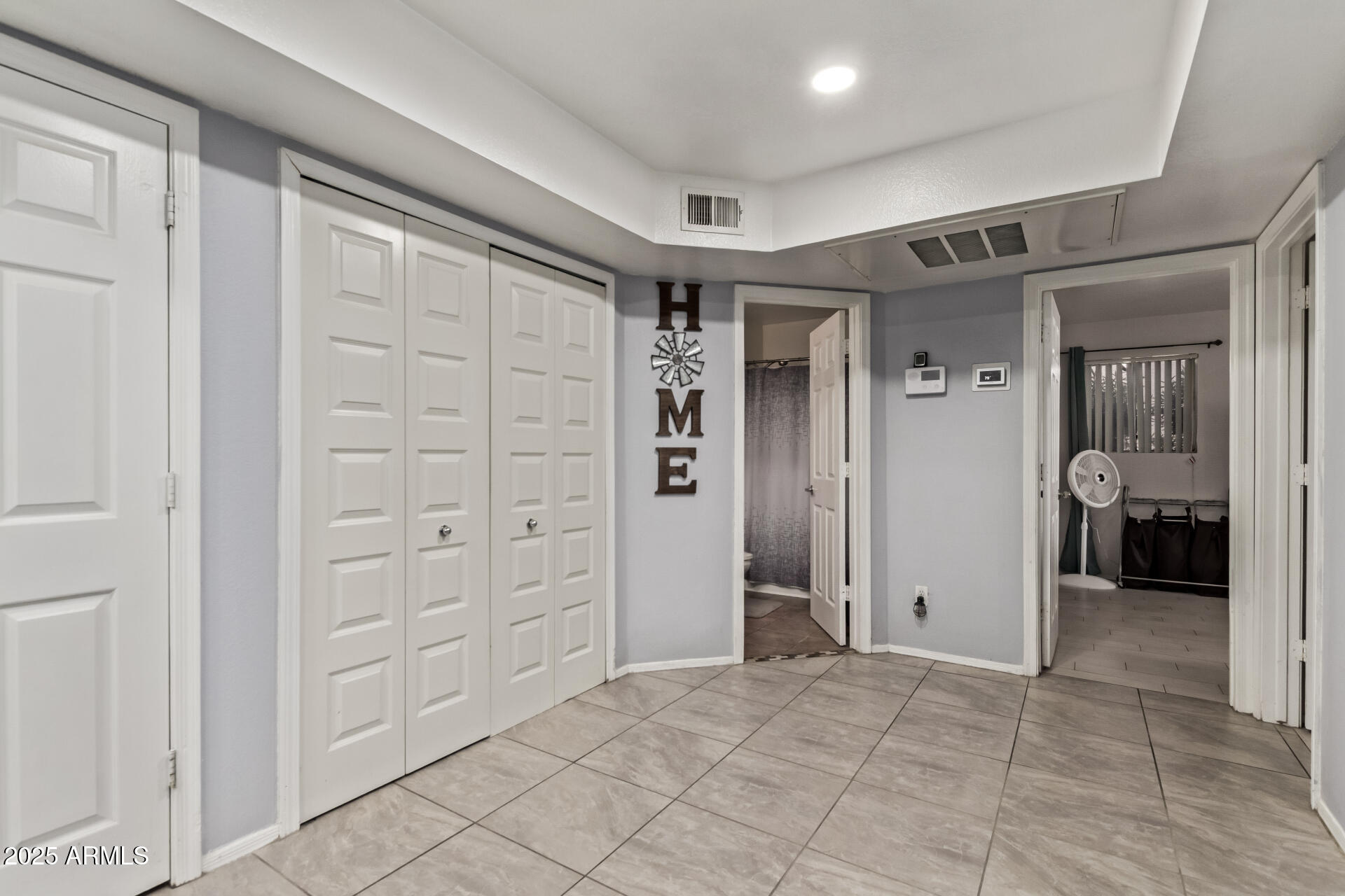 1331 West Baseline Road, Unit 153 Mesa, AZ 85202 - Photo 11 of 25 a view of a hallway with wooden shelves