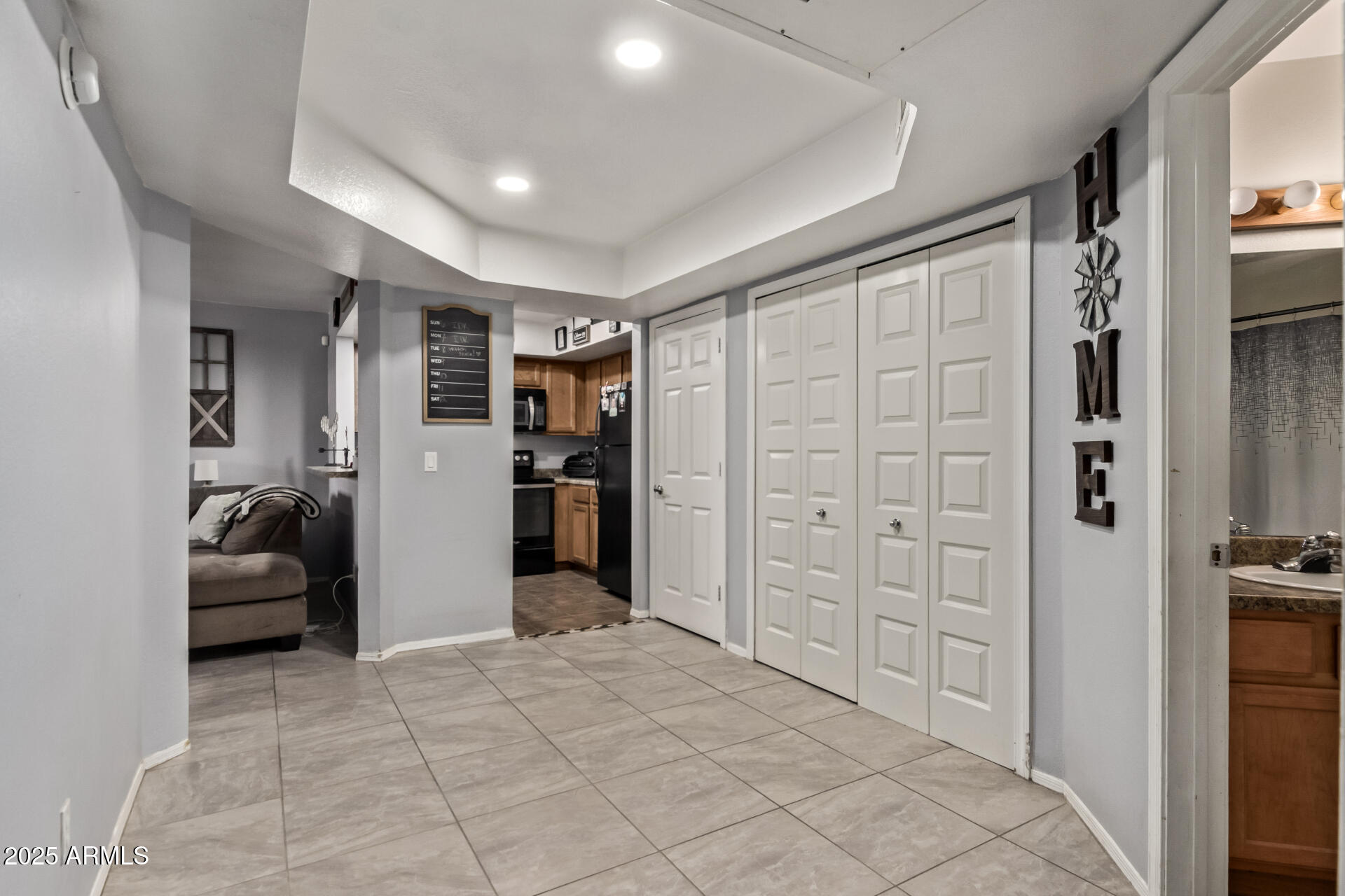 1331 West Baseline Road, Unit 153 Mesa, AZ 85202 - Photo 12 of 25 a view of livingroom with walk in closet and bedroom