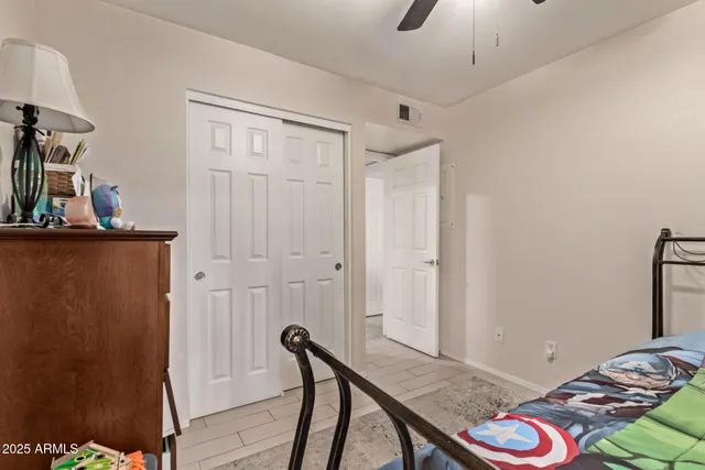 a bedroom with a bed and a dresser