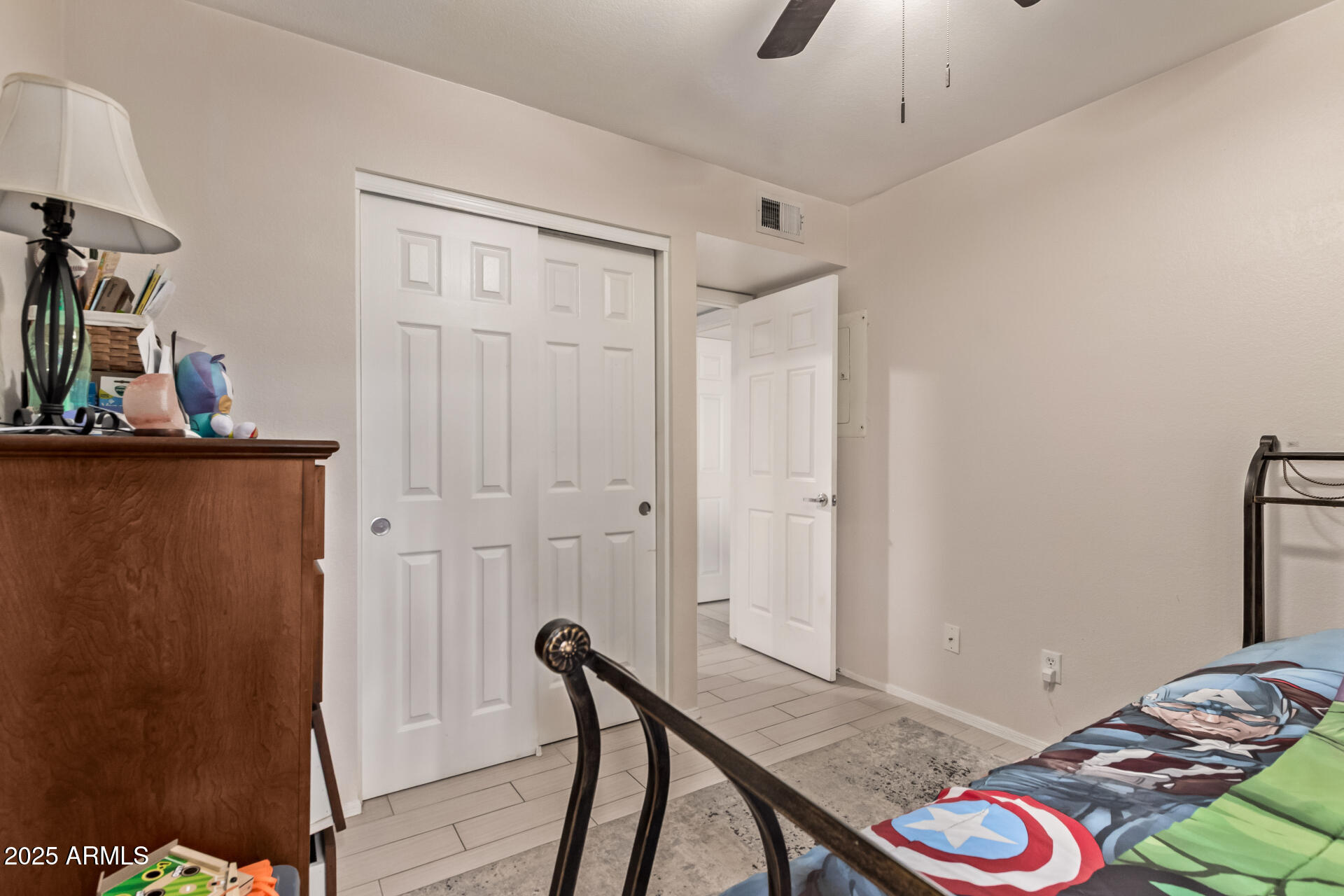 1331 West Baseline Road, Unit 153 Mesa, AZ 85202 - Photo 13 of 25 a bedroom with a bed and a dresser