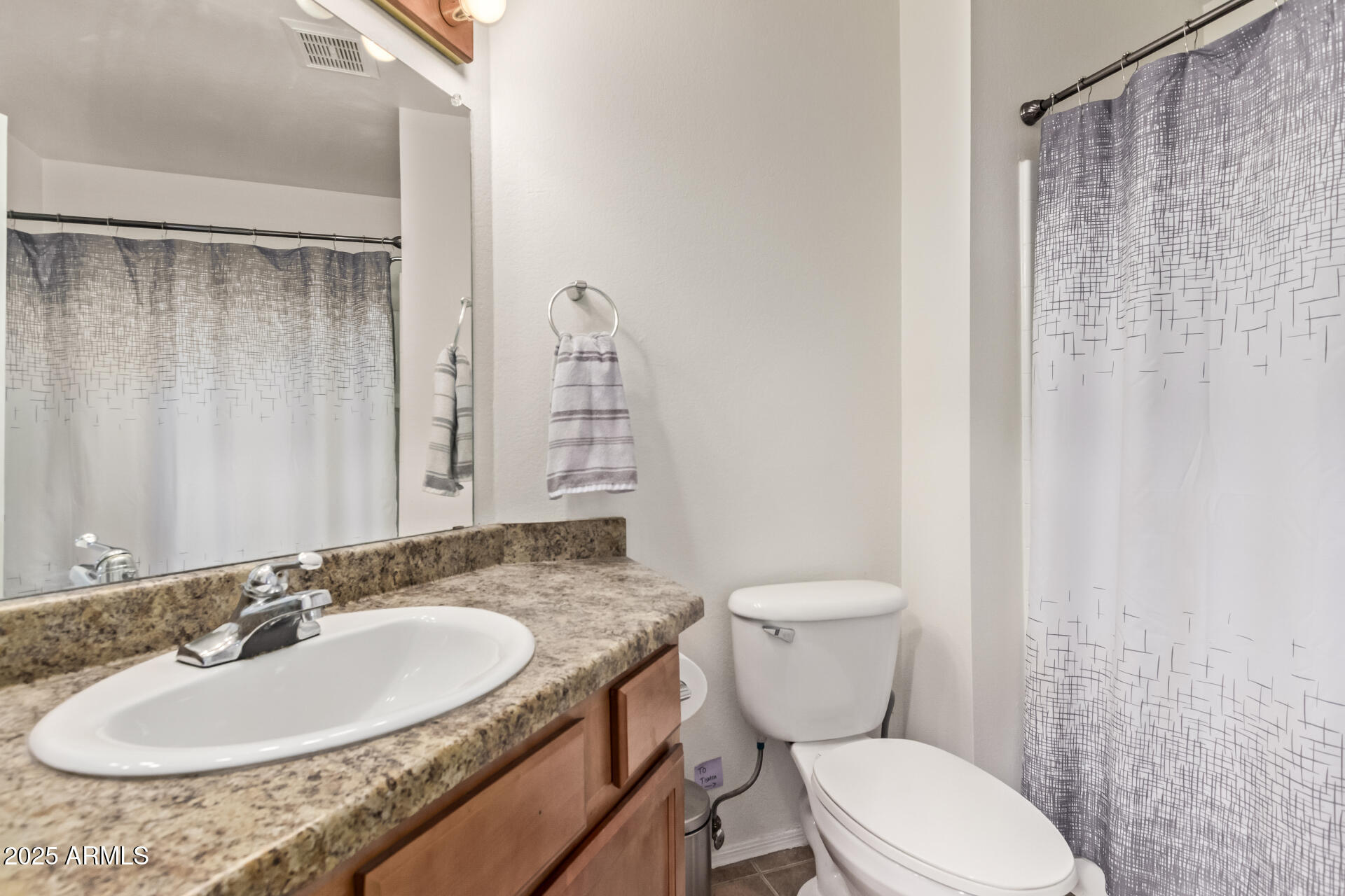 1331 West Baseline Road, Unit 153 Mesa, AZ 85202 - Photo 14 of 25 a bathroom with a granite countertop sink toilet and a mirror