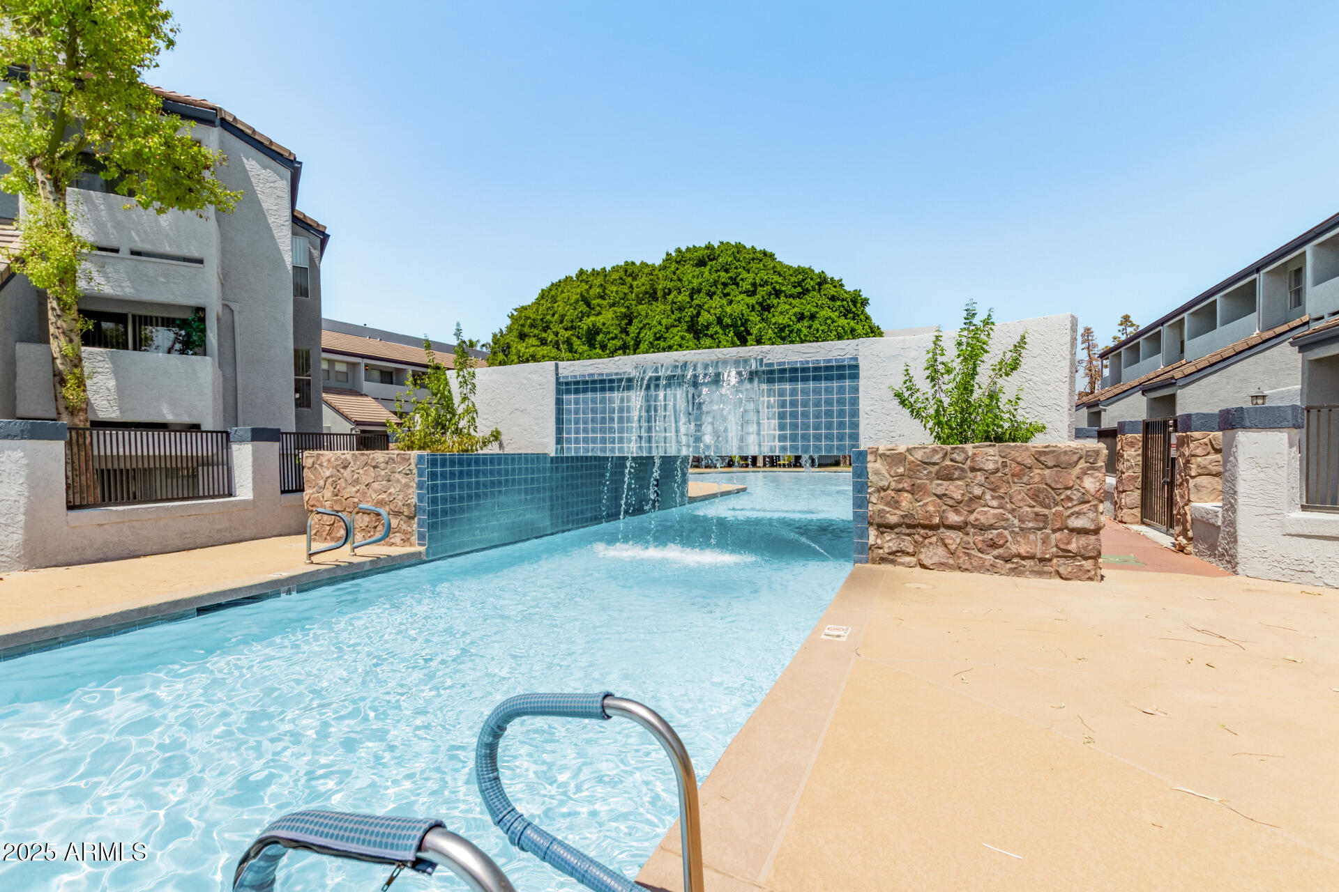 1331 West Baseline Road, Unit 153 Mesa, AZ 85202 - Photo 18 of 25 a front view of a house with a yard