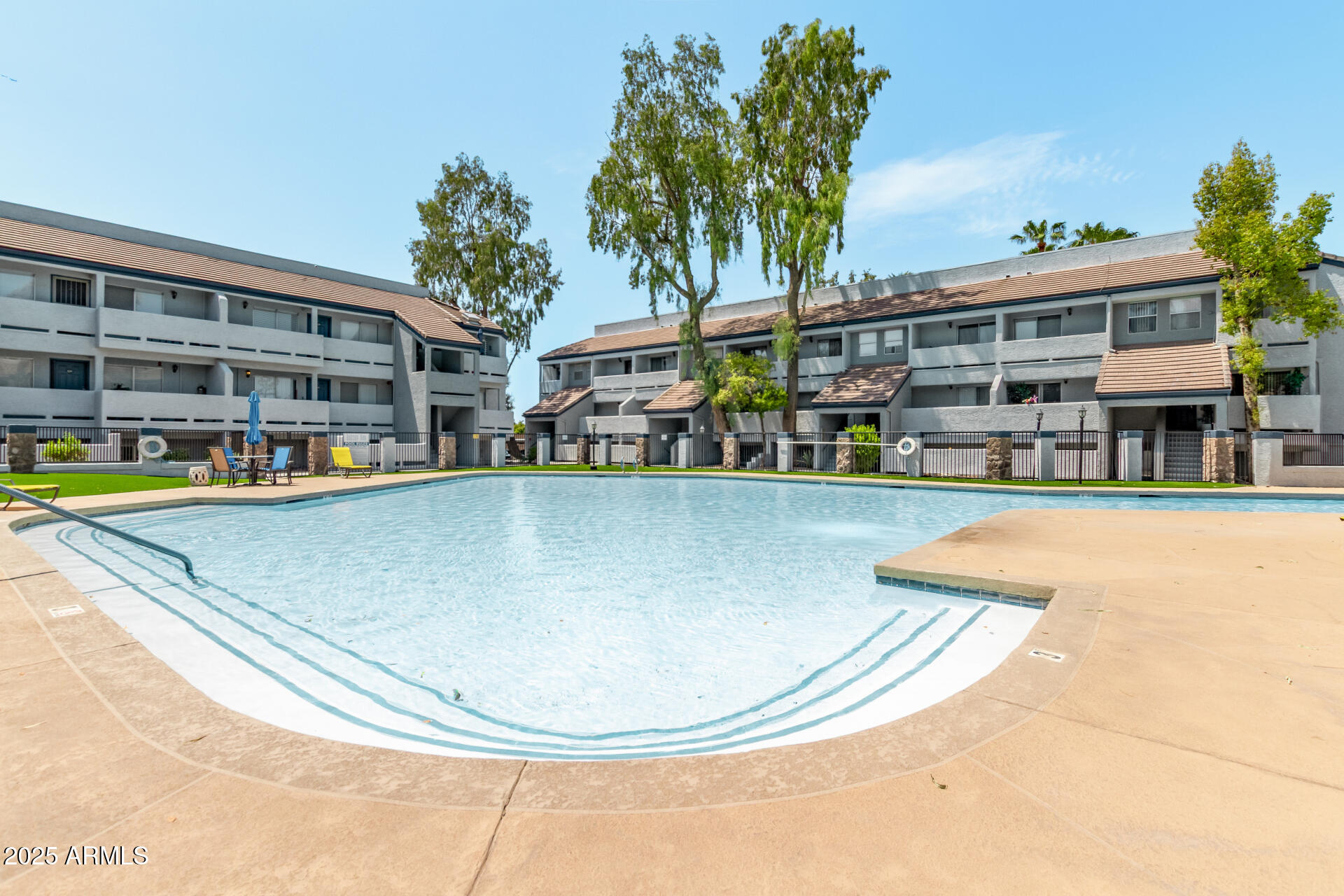 1331 West Baseline Road, Unit 153 Mesa, AZ 85202 - Photo 20 of 25 swimming pool view with a seating space and a garden