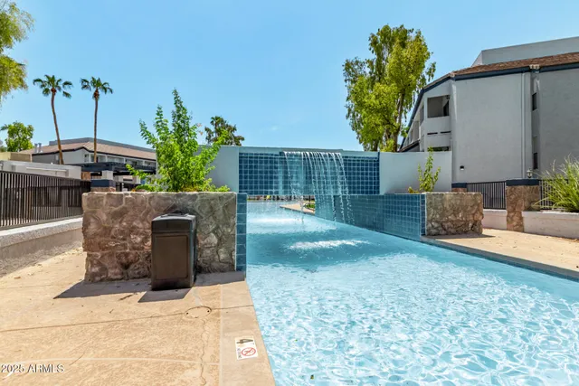 a view of a backyard house and potted plants