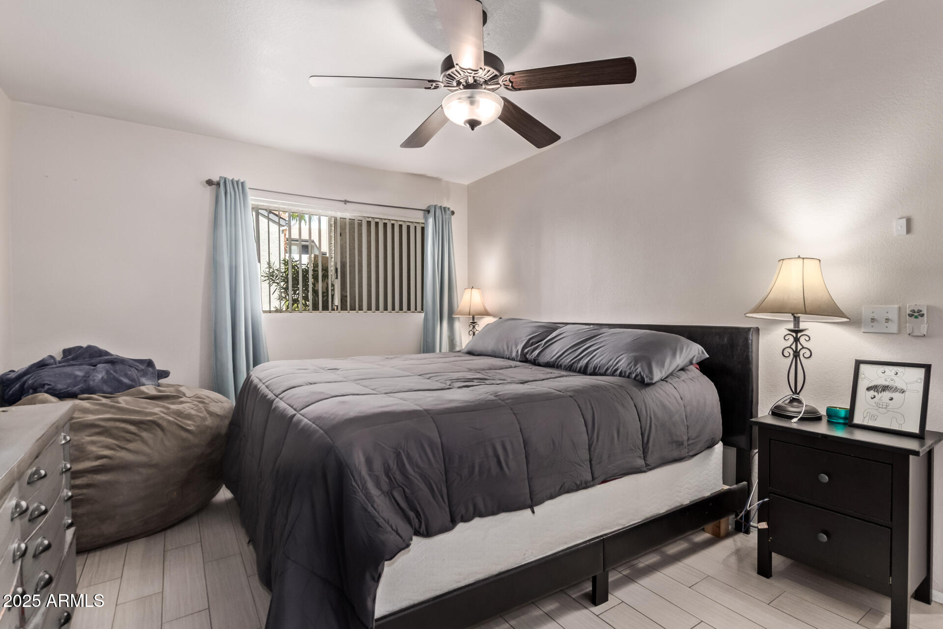 1331 West Baseline Road, Unit 153 Mesa, AZ 85202 - Photo 7 of 25 a bedroom with a bed and a window