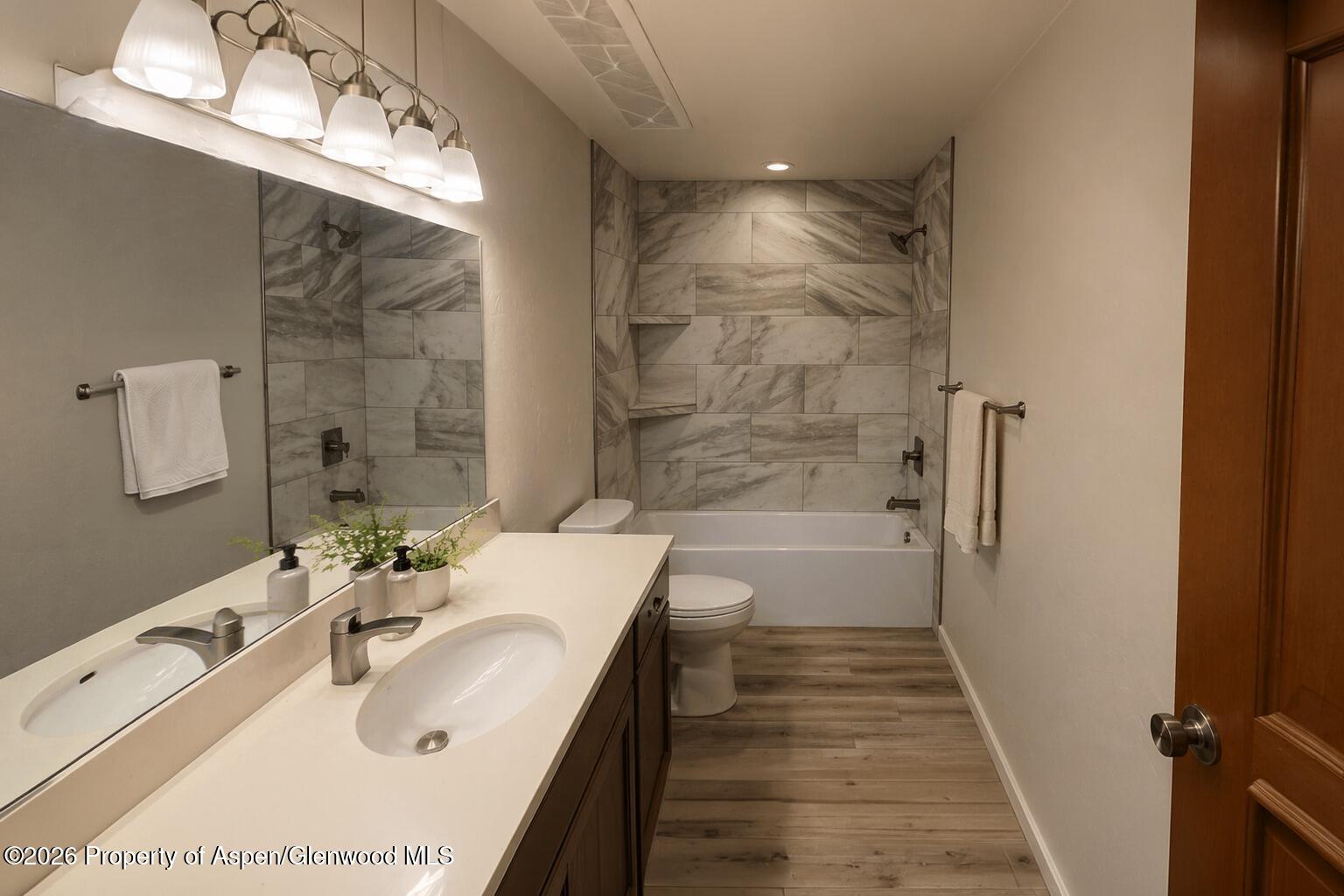 1648 Arabian Avenue Rifle, CO 81650 - Photo 13 of 15 a bathroom with a bathtub and a sink
