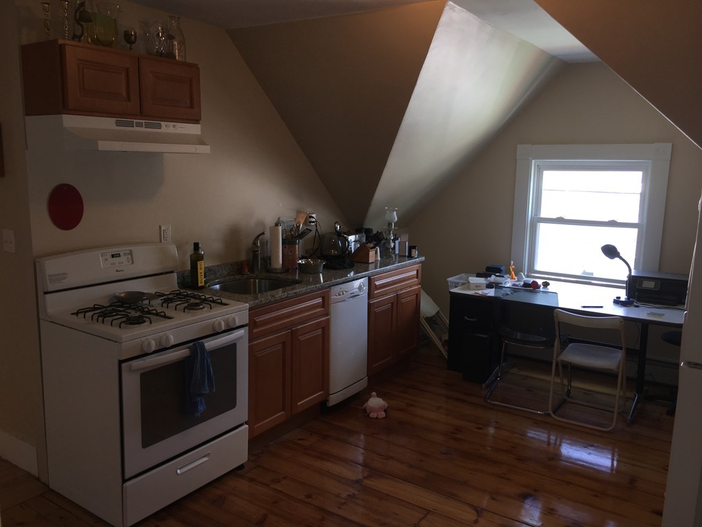 12 Union Street Beverly, MA 01915 - Photo 8 of 19 a kitchen with a stove wooden floor and a sink