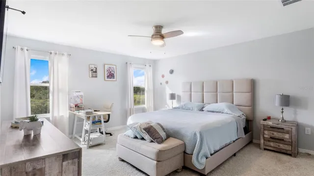 a bedroom with a bed and a couch