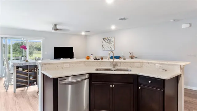 a kitchen with a sink and cabinets