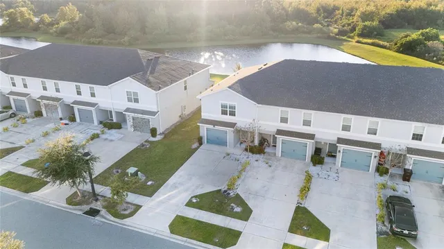 an aerial view of a house with a swimming pool