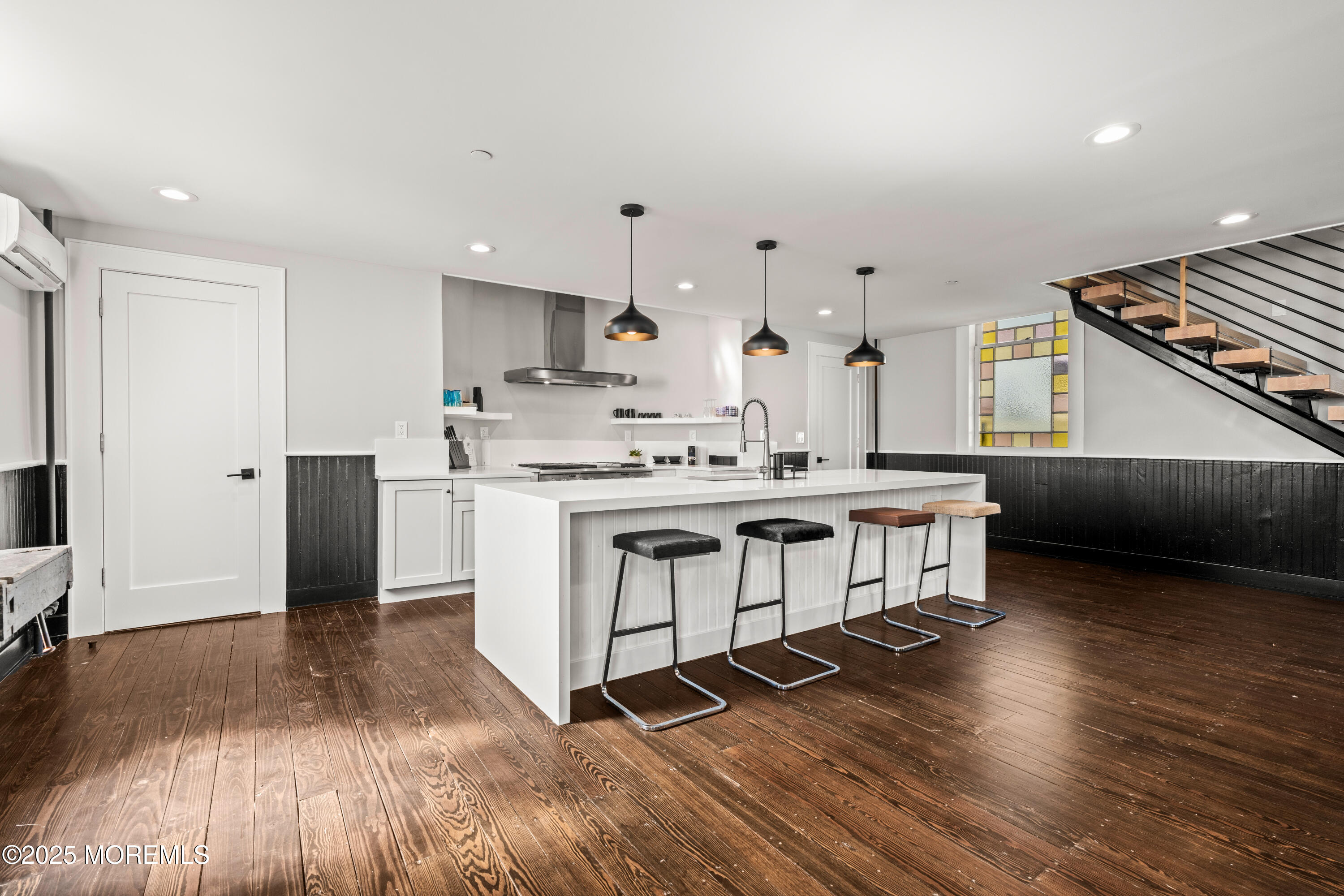 73 3rd Avenue, Unit A Atlantic Highlands, NJ 07716 - Photo 11 of 19 a kitchen with stainless steel appliances a stove a sink and a refrigerator