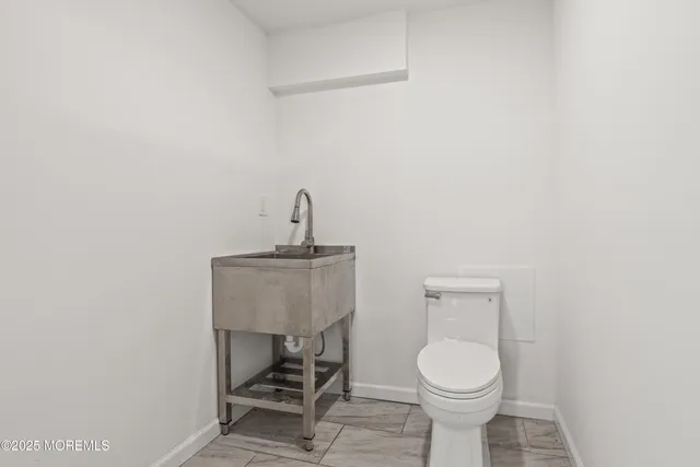 a picture of a bathroom with a shower