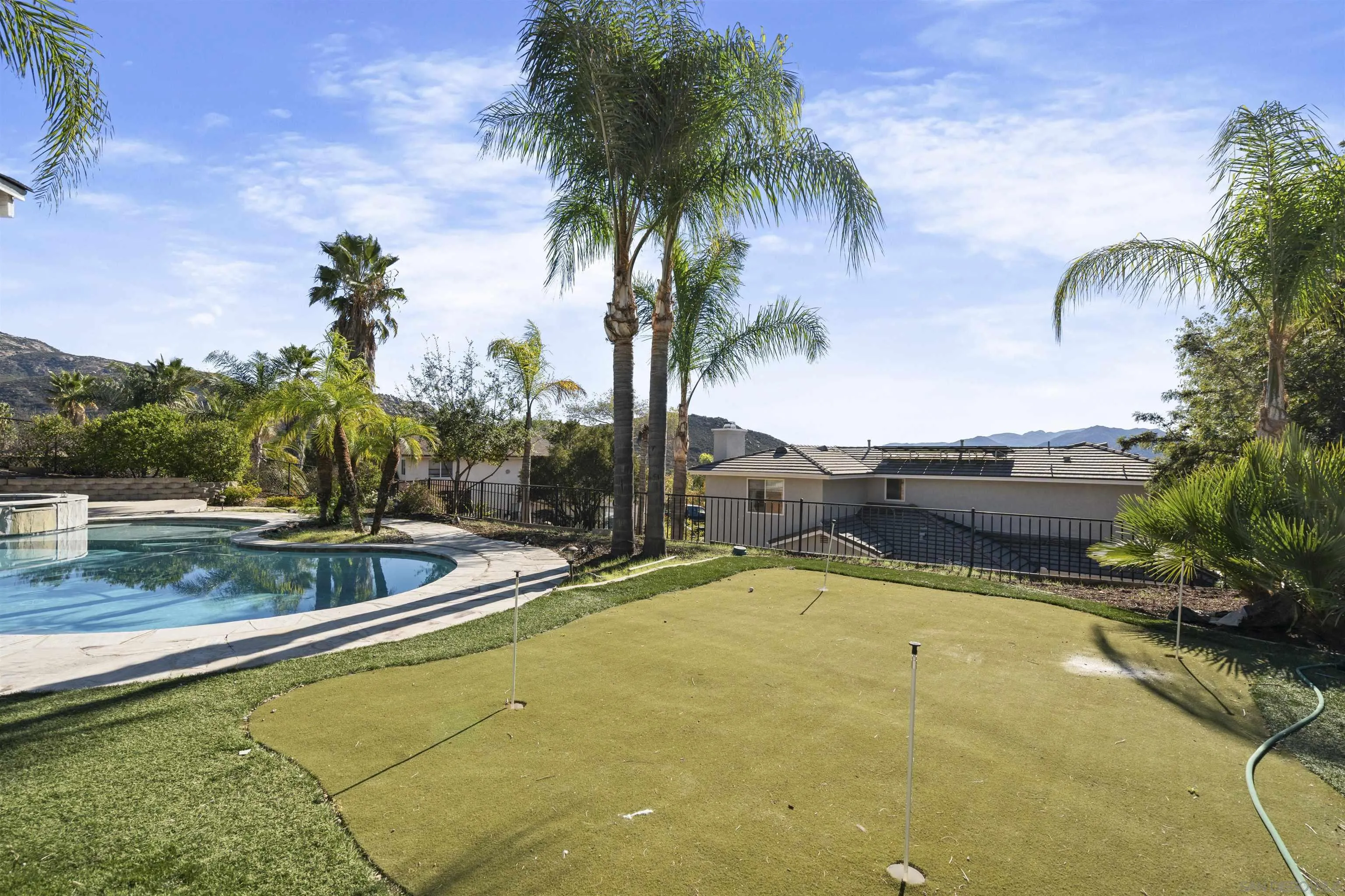 24534 Rutherford Road Ramona, CA 92065 - Photo 5 of 19 a view of swimming pool with a table and chairs