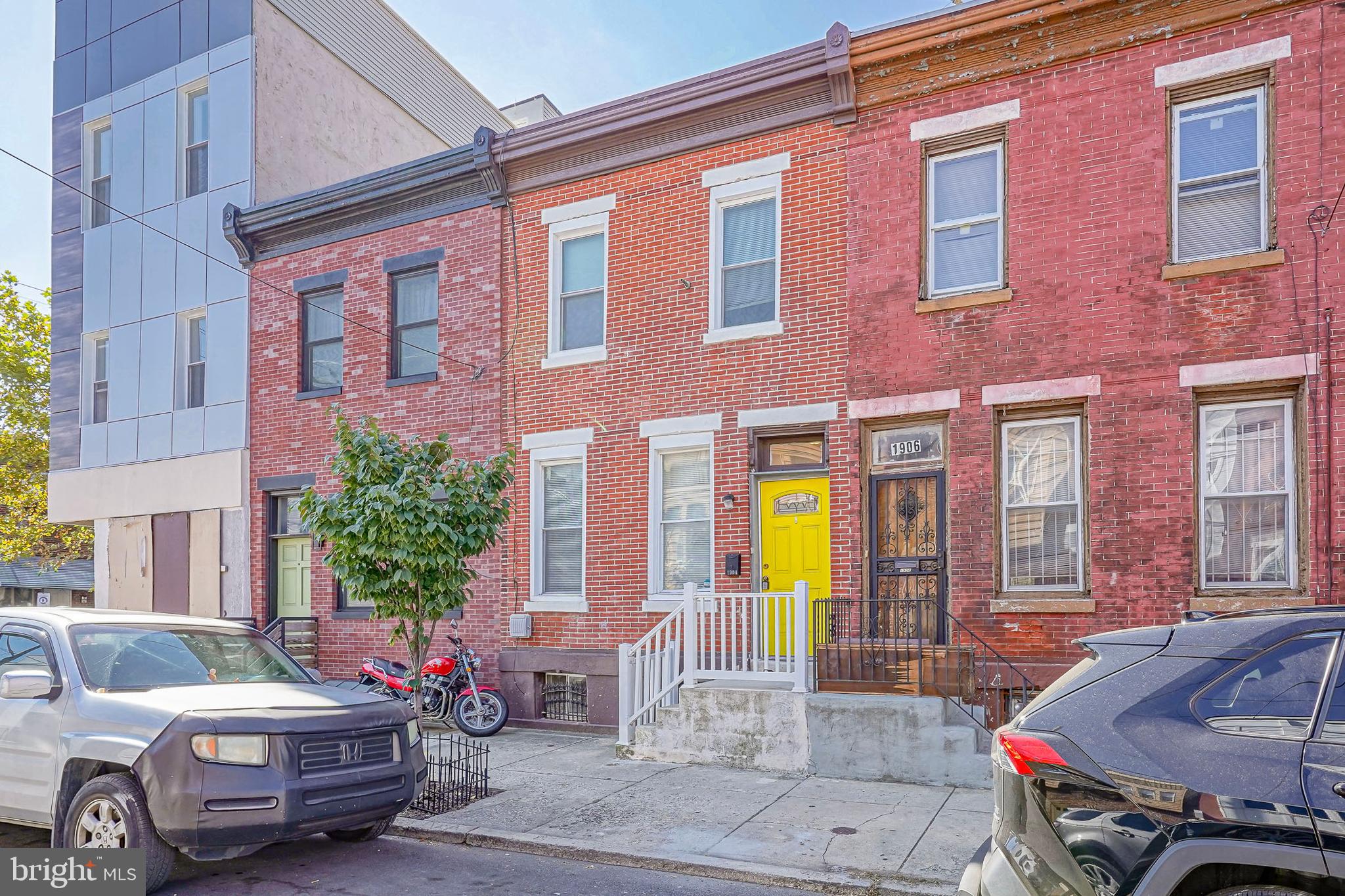 1904 Federal Street Philadelphia, PA 19146 - Photo 2 of 22 a front view of a house with outdoor seating and a potted plant