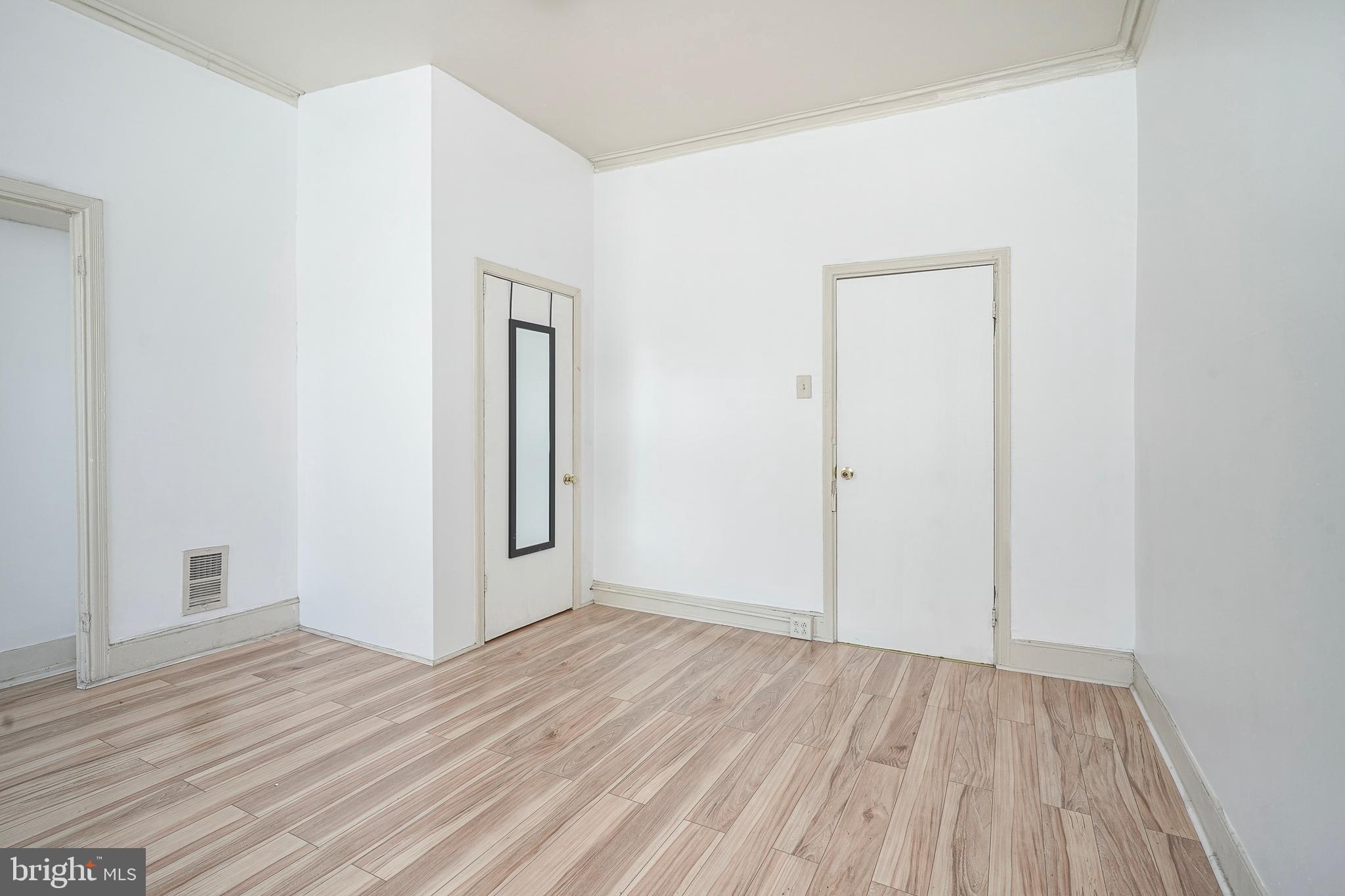 1904 Federal Street Philadelphia, PA 19146 - Photo 21 of 22 an empty room with wooden floor and closet