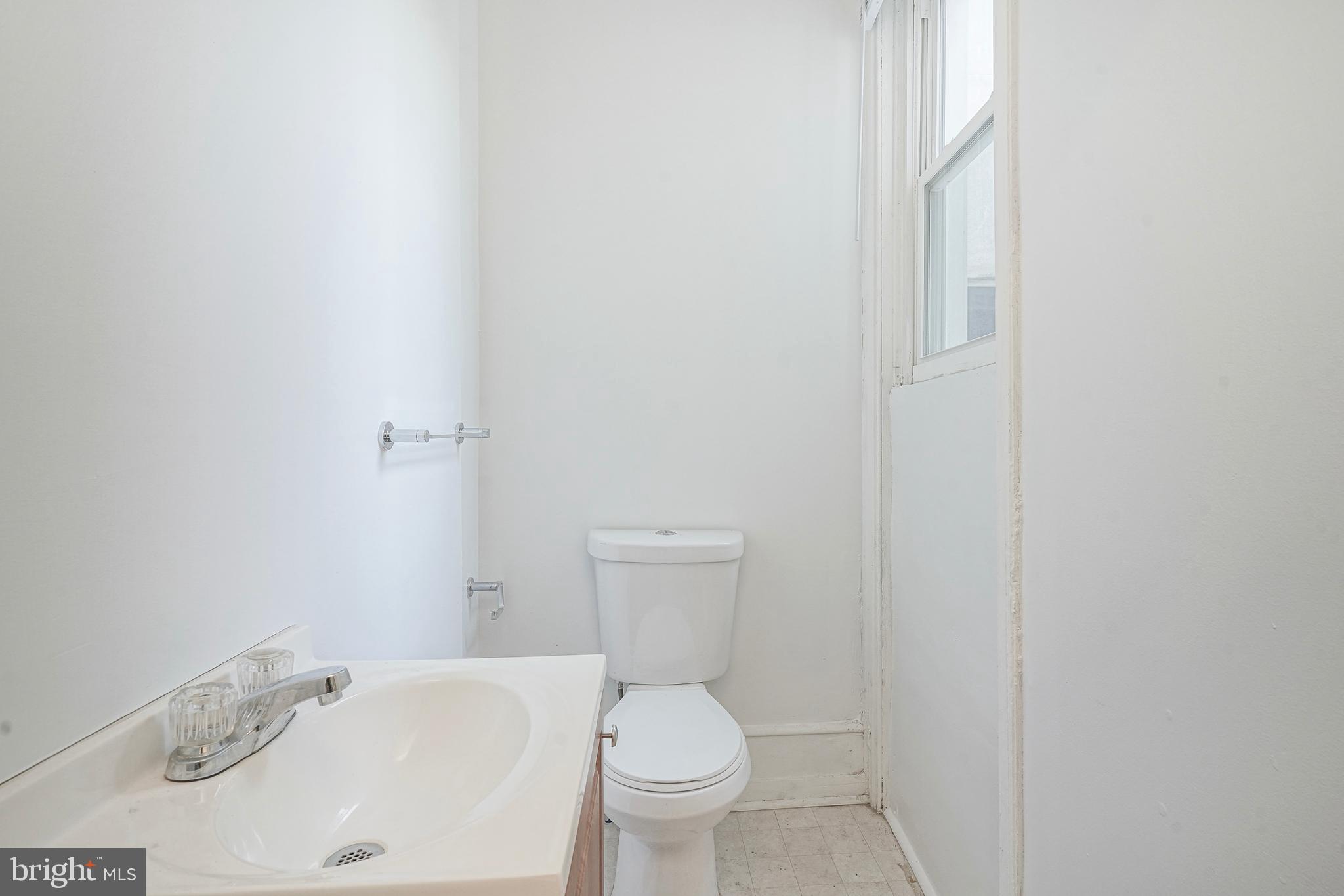 1904 Federal Street Philadelphia, PA 19146 - Photo 5 of 22 a white toilet sitting next to a bathroom sink