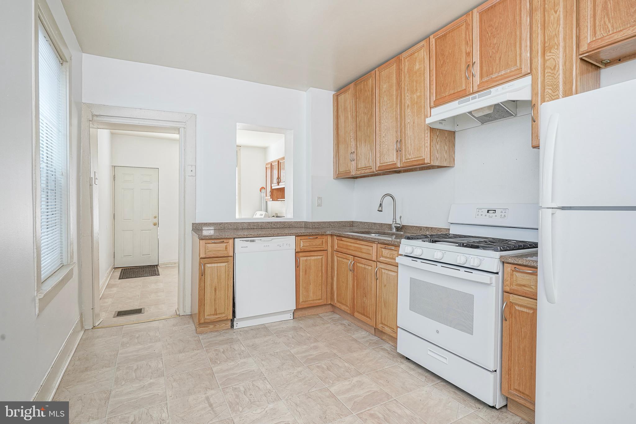 1904 Federal Street Philadelphia, PA 19146 - Photo 6 of 22 a kitchen with white cabinets and white appliances