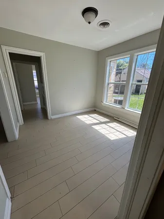 a view of an empty room and window