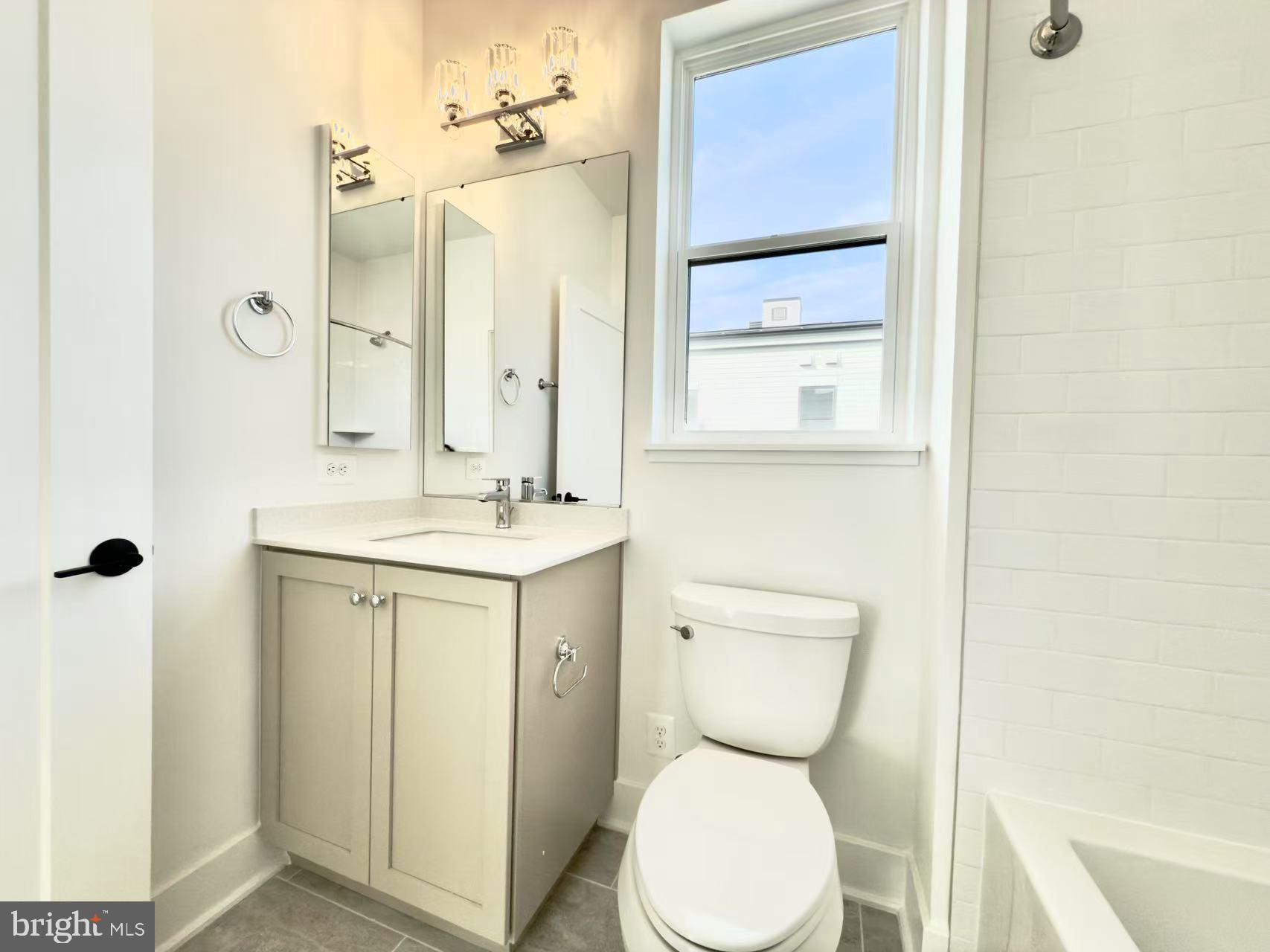 2106 Tysons Ridgeline Road Falls Church, VA 22043 - Photo 35 of 47 a bathroom with a toilet sink and mirror