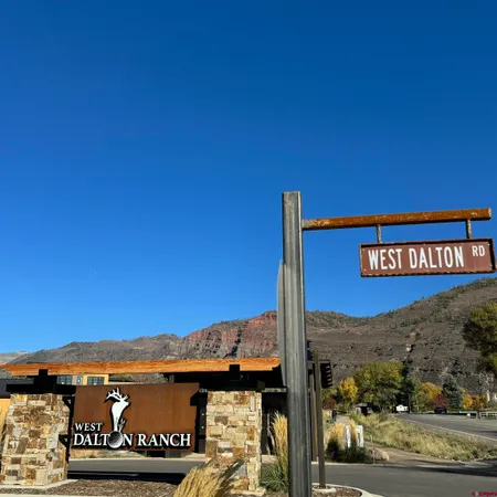 a view of a street with a building in the background