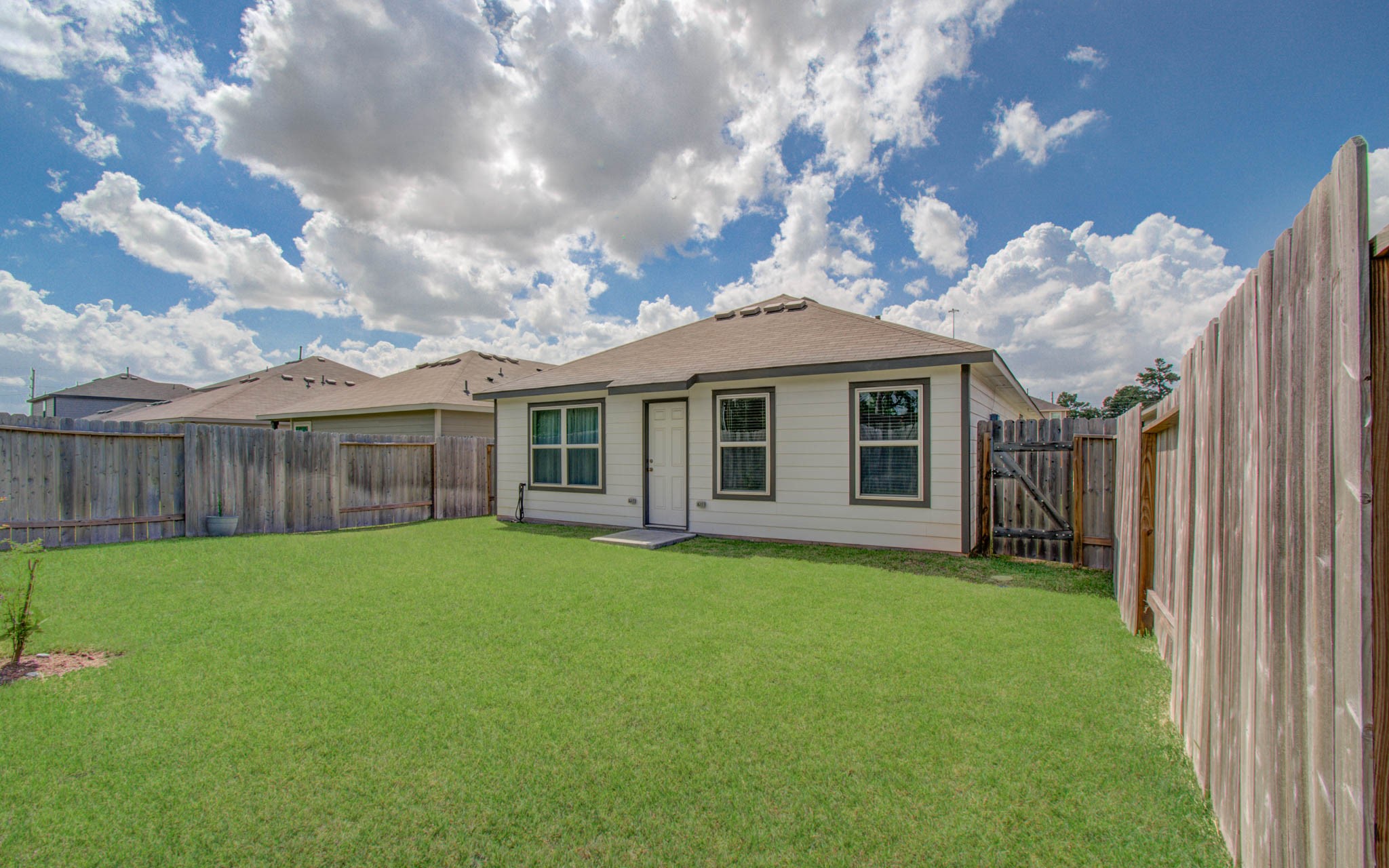 2030 Brixham Bluff Lane Spring, TX 77373 - Photo 28 of 29 Nice backyard equipped with sprinkler system