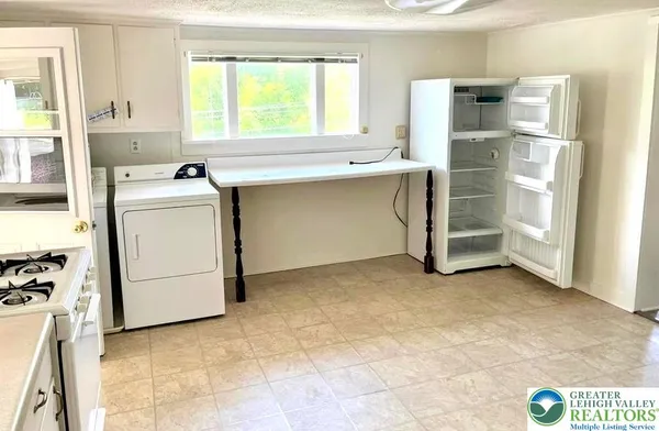 a utility room with closet dryer and washer