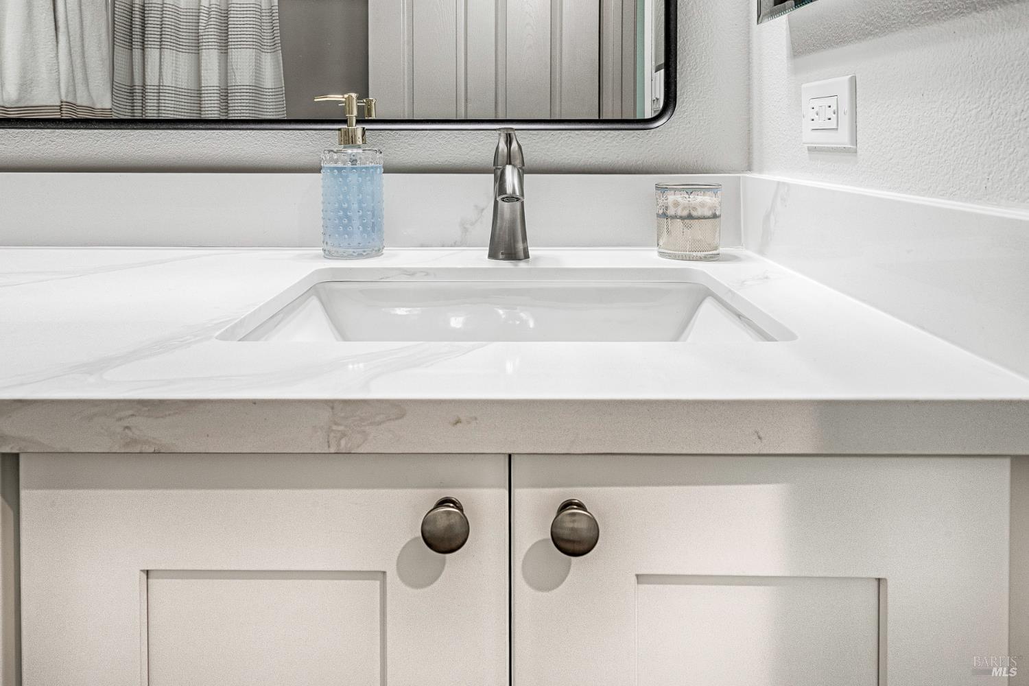 1960 Las Ventanas Drive Santa Rosa, CA 95407 - Photo 24 of 36 a bathroom with a sink and a mirror