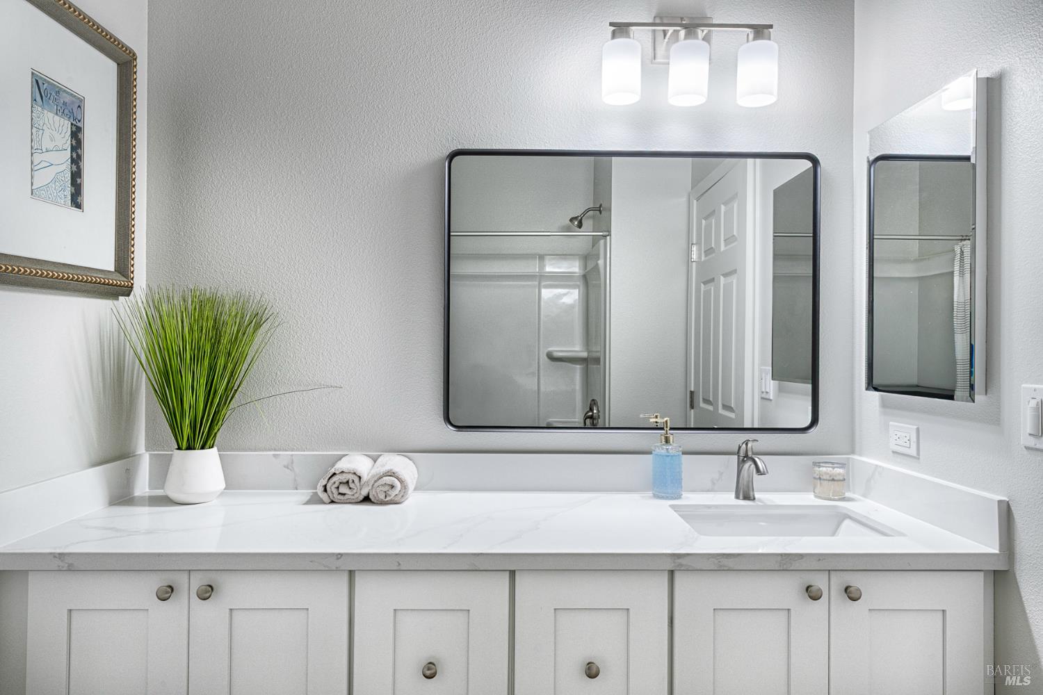 1960 Las Ventanas Drive Santa Rosa, CA 95407 - Photo 26 of 36 a bathroom with cabinets and mirror