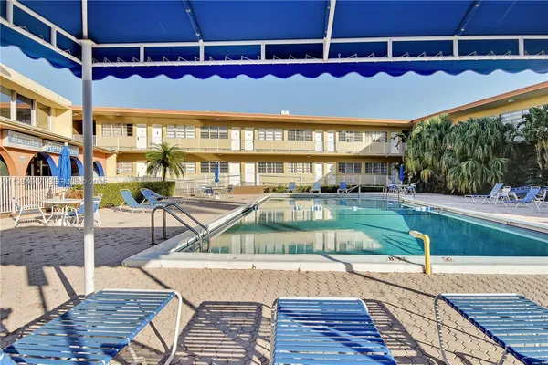a view of a swimming pool with a patio