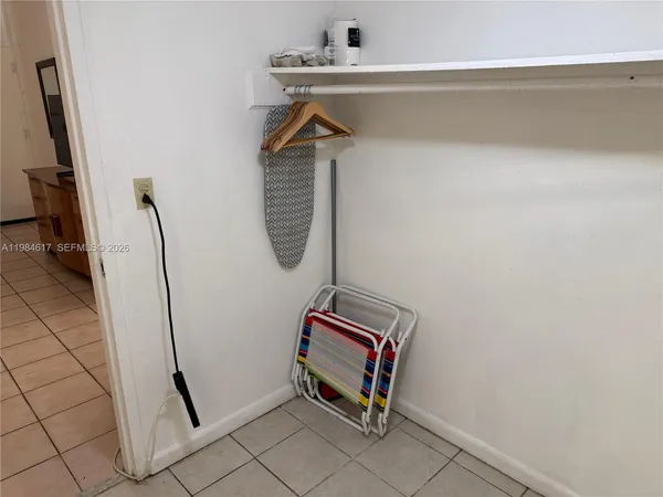 a view of storage and utility room with a sink