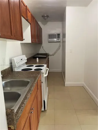 a kitchen with a stove and a microwave
