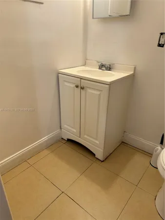 a view of a utility room with a sink