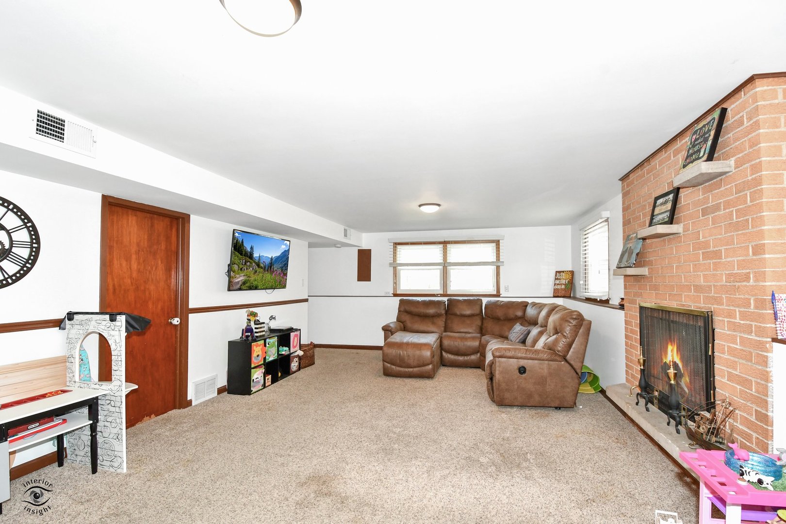 802 Timber Lane Darien, IL 60561 - Photo 12 of 23 a living room with furniture a window and a fireplace