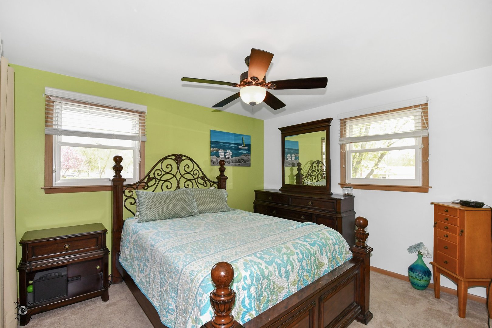 802 Timber Lane Darien, IL 60561 - Photo 13 of 23 a bedroom with a bed and a dresser with a large window