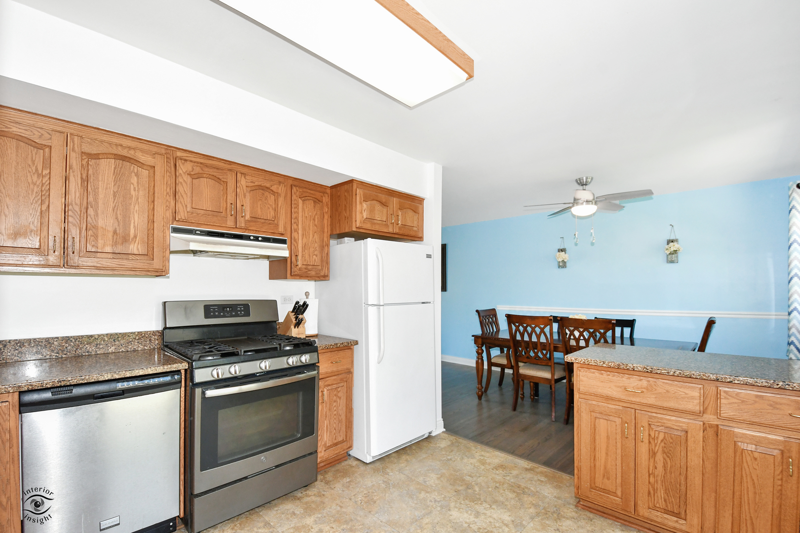 802 Timber Lane Darien, IL 60561 - Photo 9 of 23 a kitchen with stainless steel appliances granite countertop a sink stove and refrigerator