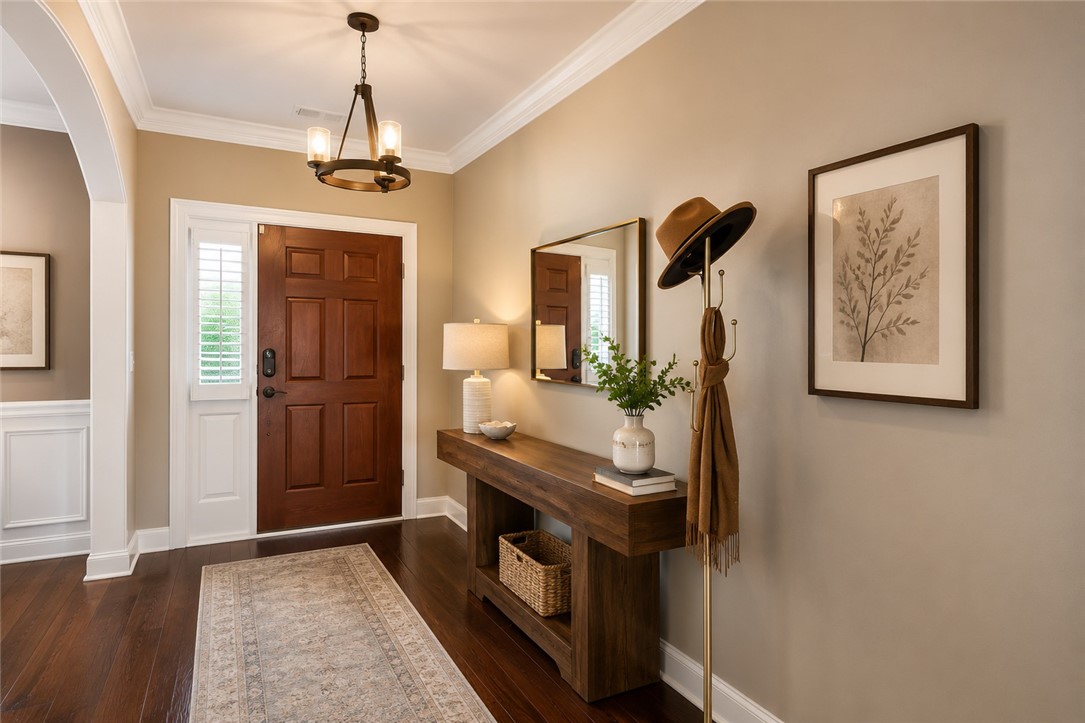15 Fawn Hill Drive Anderson, SC 29621 - Photo 3 of 38 The inviting entryway features rich wood flooring, crisp crown molding, and a warm, welcoming ambiance.