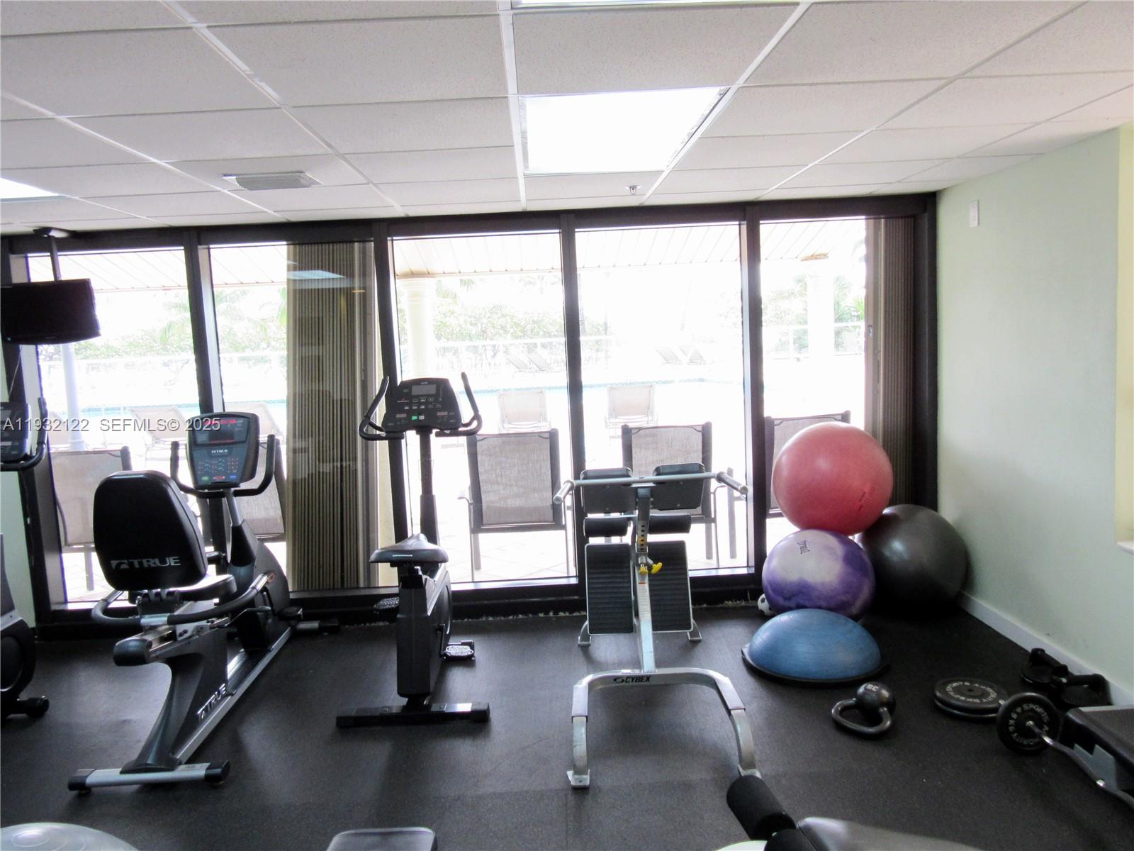 10185 Collins Avenue, Unit 321 Bal Harbour, FL 33154 - Photo 16 of 17 a room with gym equipment and a large window